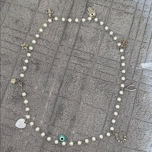 Beautiful pearl necklace with multiple charms !
